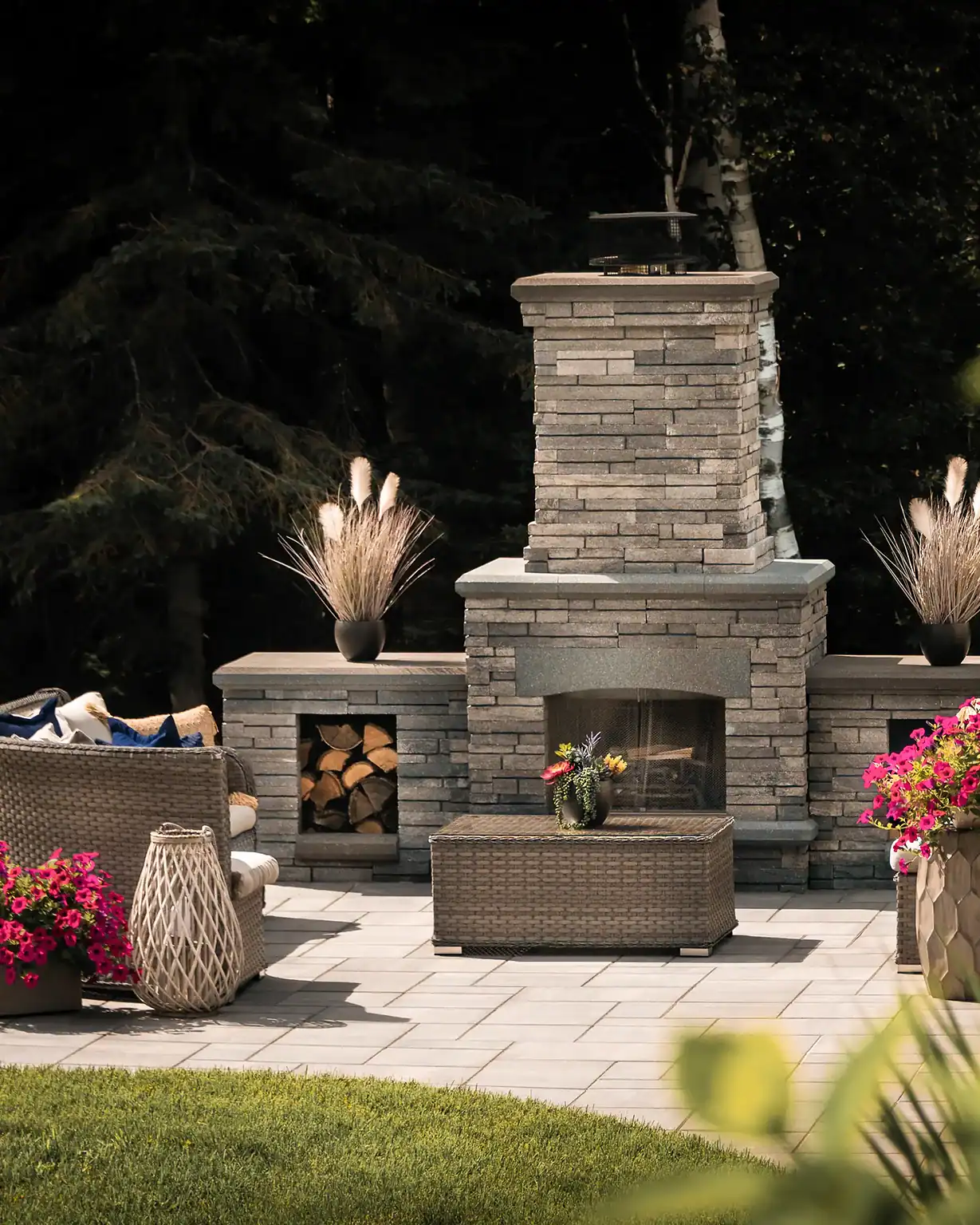 Wood-burning outdoor stone fireplace with hearth by Miller Creek